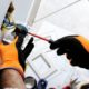 electrician fixing a wall plug