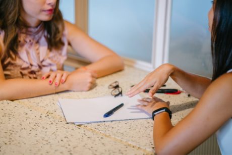 therapist talking to female patient