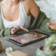 woman making powerpoint in tablet device