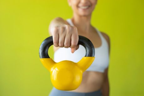 woman holding kettlebell