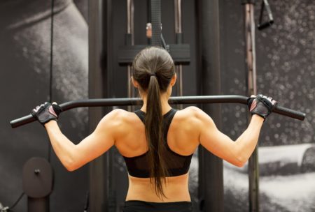 woman in black sports bra working out