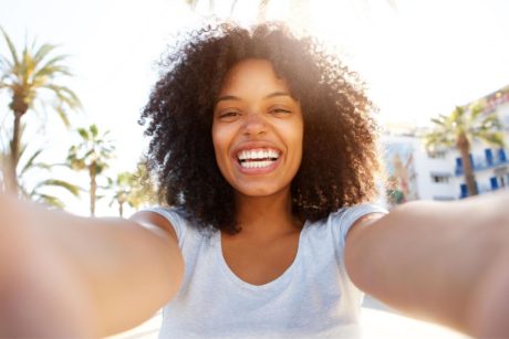 happy woman in white shirt