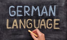 German for Beginners concept with German Language chalked on a blackboard, indicating a start to learning German