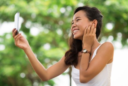 happy woman taking selfie