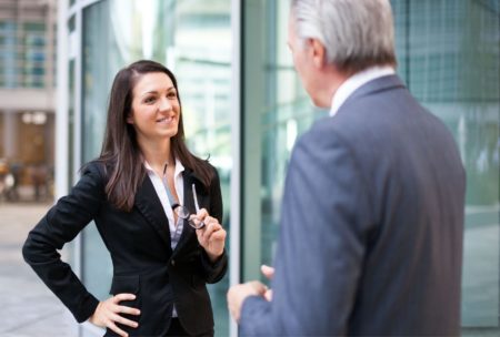 woman negotiating with man in suit