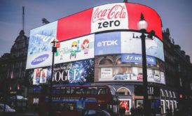 a creative marketing strategy featuring a large billboard with coca cola logo