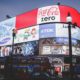 a creative marketing strategy featuring a large billboard with coca cola logo