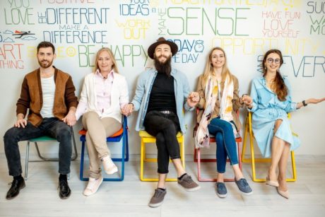 people sitting on chairs with words on them promoting be happier with positive psychology