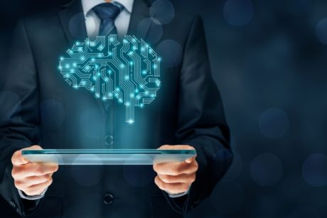 man in suit holding plate projecting a human brain