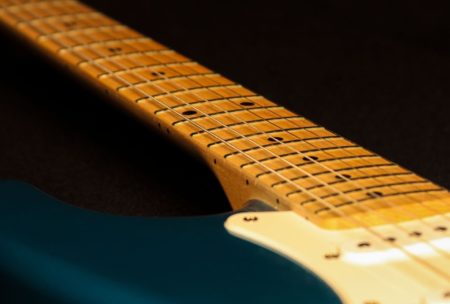 blue guitar with guitar fretboard