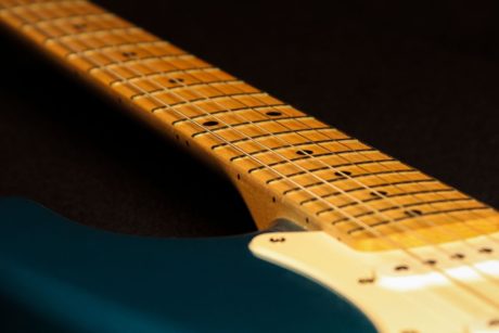 blue guitar with guitar fretboard