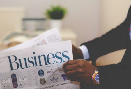 man reading business news