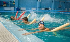 children having swimming lessons