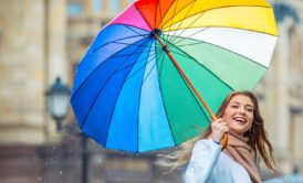 woman holding colorful umbrella