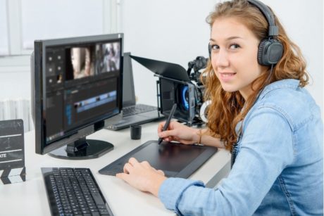 woman editing video with adobe