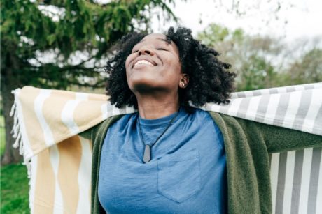 happy woman in blue top