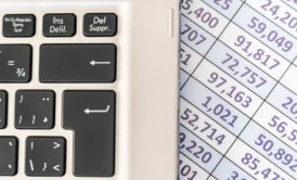 laptop keyboard and excel sheet