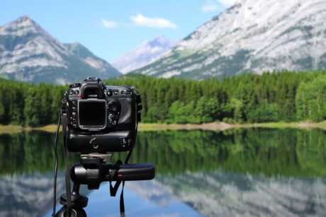 camera and mountain landscape