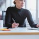 woman taking notes