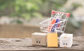 small grocery cart and paper bags