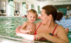 mom and baby in swimming pool