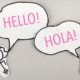 stick figures saying hello and spanish hola