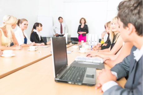 manager talking to team in conference room