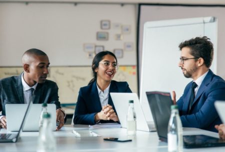 three colleagues having a workplace meeting