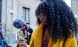 woman filming with her smartphone