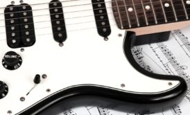 close up of a white electronic guitar