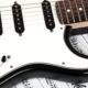 close up of a white electronic guitar