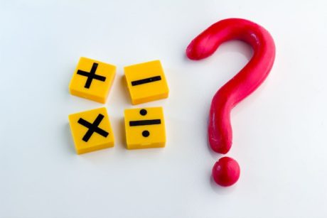 mathematical symbols beside a big red question mark