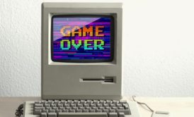 desktop computer with words game over on display
