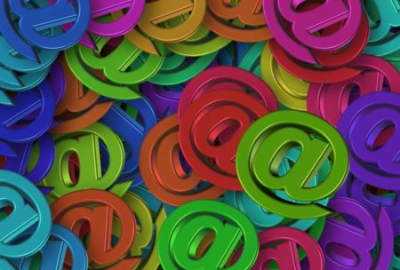 multi-colored at signs for email in business communication