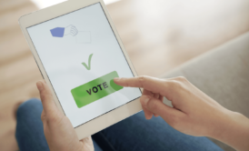 woman voting on ipad