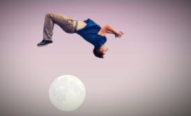 male gymnast jumping over the moon