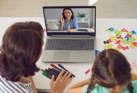 mother and daughter watching online video