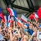 people waving french flag