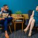 a man and woman discussing how to become a social worker while sitting in chairs