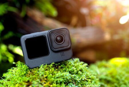 An action camera on a mossy rock - perfect GoPro for beginners