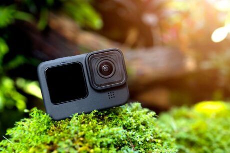 An action camera on a mossy rock - perfect GoPro for beginners