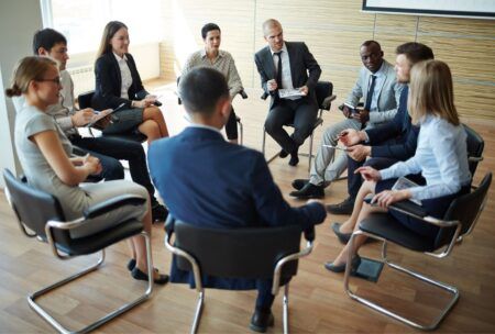 business professionals discussing measuring training effectiveness in a meeting room