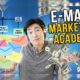 a man displaying money and email marketing academy banner, promoting email marketing copywriting