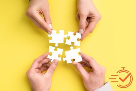 hands holding puzzle pieces on yellow background, symbolizing collaboration skills