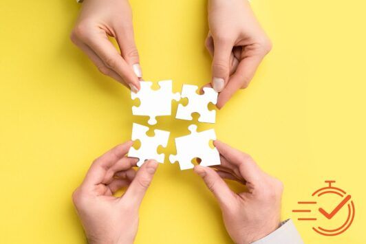 hands holding puzzle pieces on yellow background, symbolizing collaboration skills