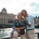 smiling couple on bridge exploring the joy of gerontology and psychology of aging