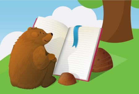 bear reading book in forest, learning how to write children's book