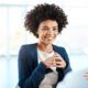 A woman in a business suit engages in conversation, showcasing her excellent listening skills with another woman.