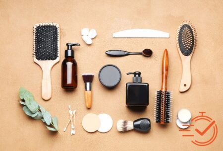 Various face and hair care items organized on a brown background, showcasing essentials for personal grooming.