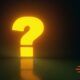 A glowing yellow question mark stands out on a dark background, representing the importance of questioning skills.